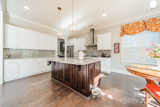 kitchen featuring wall chimney exhaust hood, stainless steel appliances, a center island with sink, dark hardwood / wood-style floors, and white cabinetry