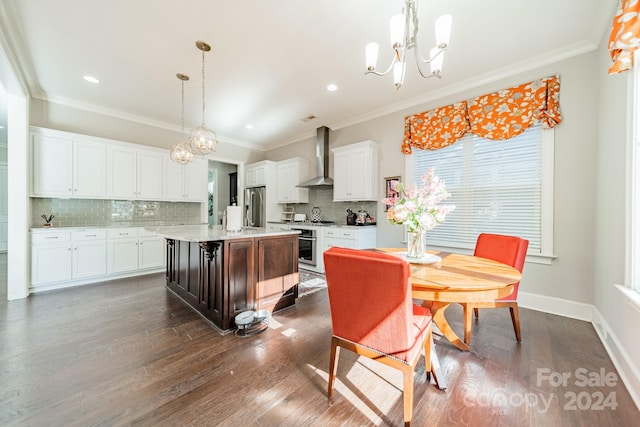 dining space featuring a chandelier, dark hardwood / wood-style floors, and ornamental molding