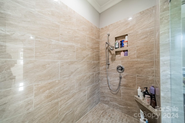 bathroom with a tile shower