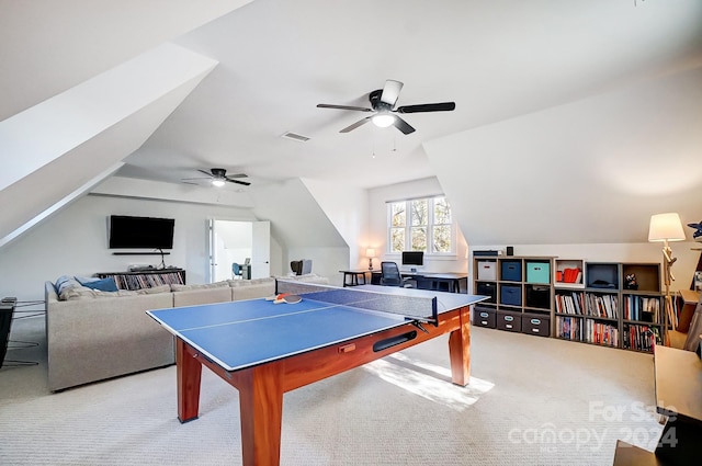 rec room featuring ceiling fan, light colored carpet, and lofted ceiling