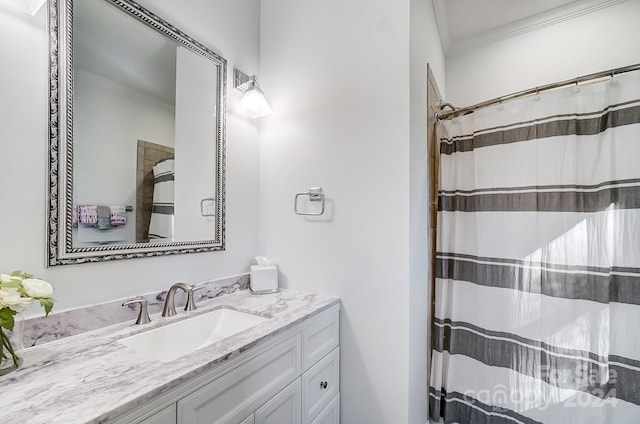 bathroom featuring vanity, walk in shower, and crown molding