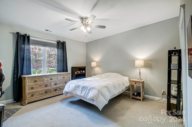 bedroom featuring ceiling fan and light colored carpet