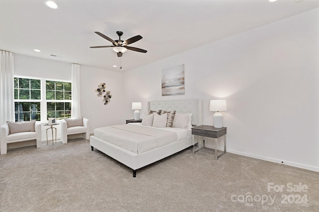 bedroom featuring ceiling fan and light carpet