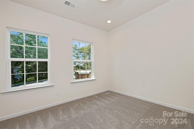 empty room with carpet flooring