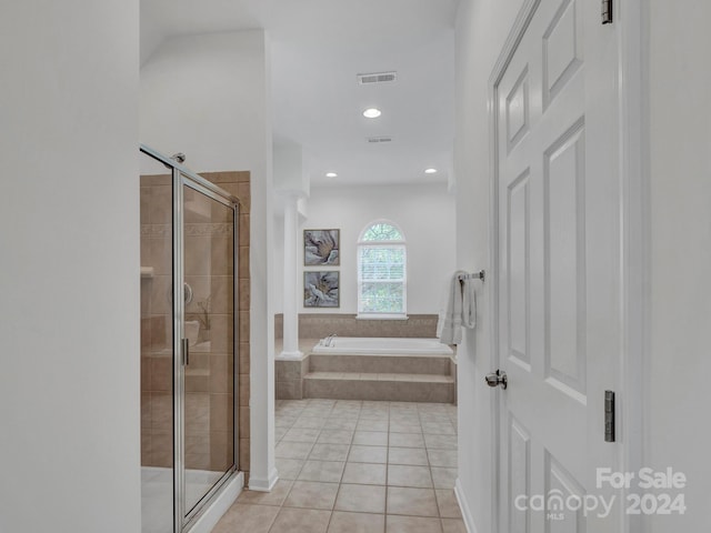 bathroom with shower with separate bathtub and tile patterned floors