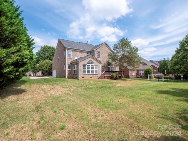 exterior space with a yard and a deck