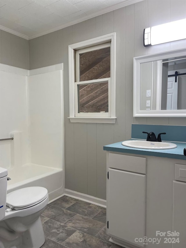 full bathroom featuring vanity, toilet, crown molding, and shower / washtub combination