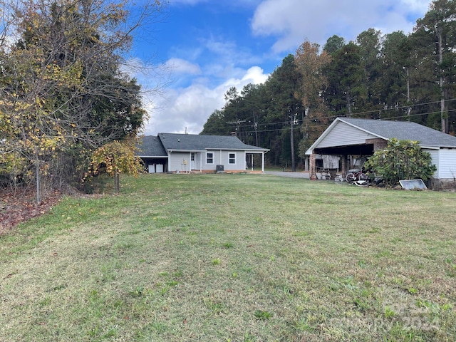 view of yard with a carport