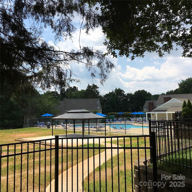 exterior space with a lawn and a gazebo