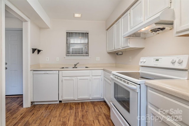 kitchen featuring white cabinetry, sink, wood-type flooring, and white appliances