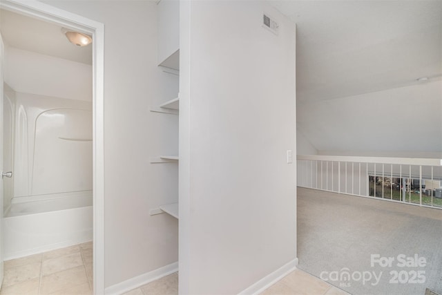 spacious closet with light tile patterned flooring