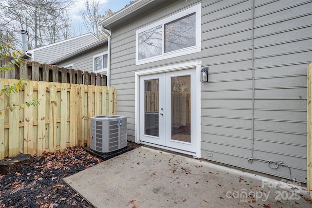 property entrance featuring central AC, french doors, and a patio