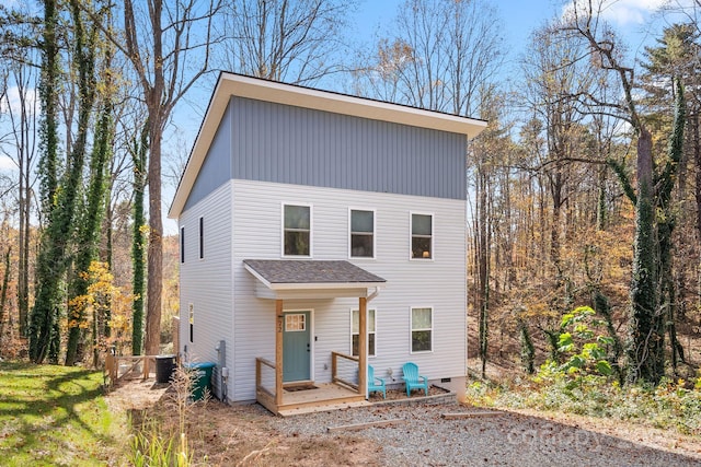 view of front of house featuring a wooden deck and central AC