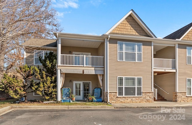 view of front of home with a balcony