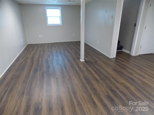 basement with dark wood-type flooring