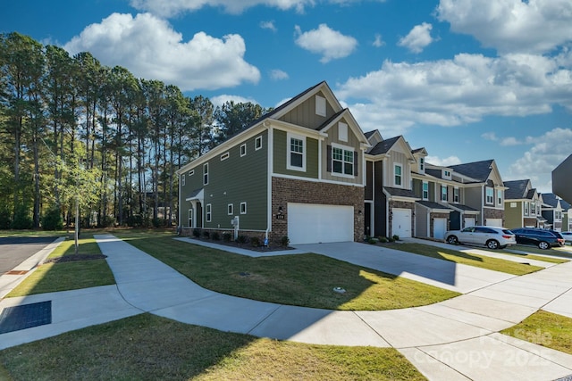 view of front facade with a front yard and a garage