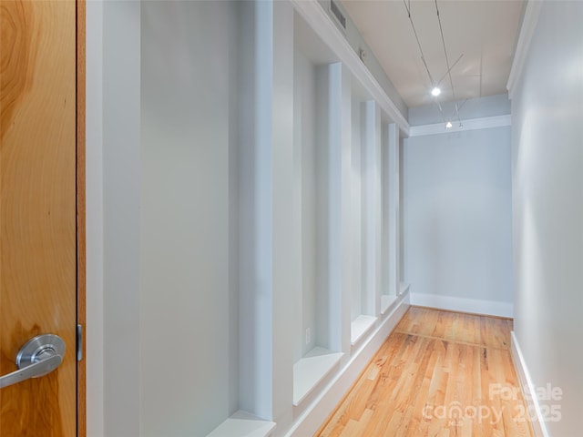 32 Broadway St Unit 230, Asheville, NC 28801 - corridor featuring attic access, wood finished floors, baseboards, and ornamental molding