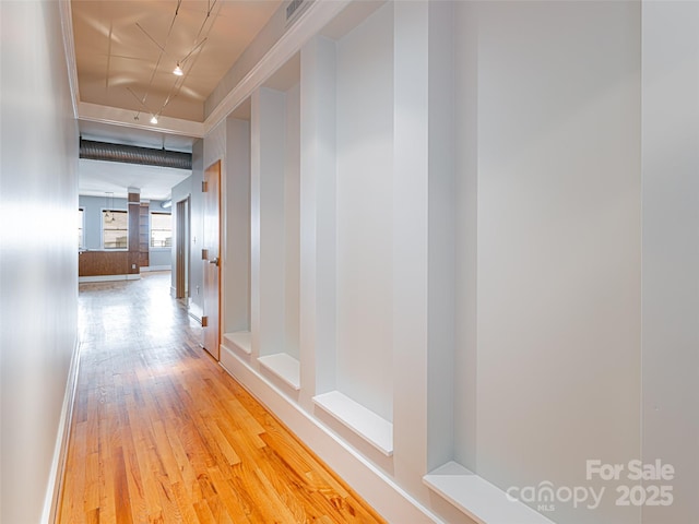 32 Broadway St Unit 230, Asheville, NC 28801 - hall with decorative columns, visible vents, and light wood-style flooring