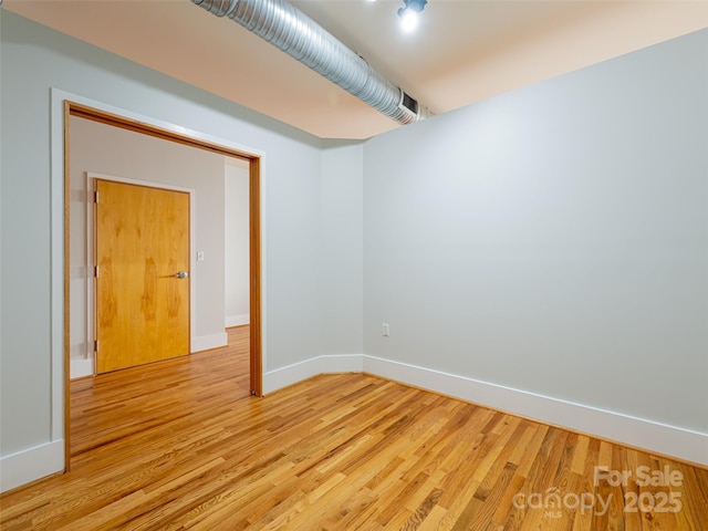 32 Broadway St Unit 230, Asheville, NC 28801 - unfurnished room with baseboards and light wood-type flooring