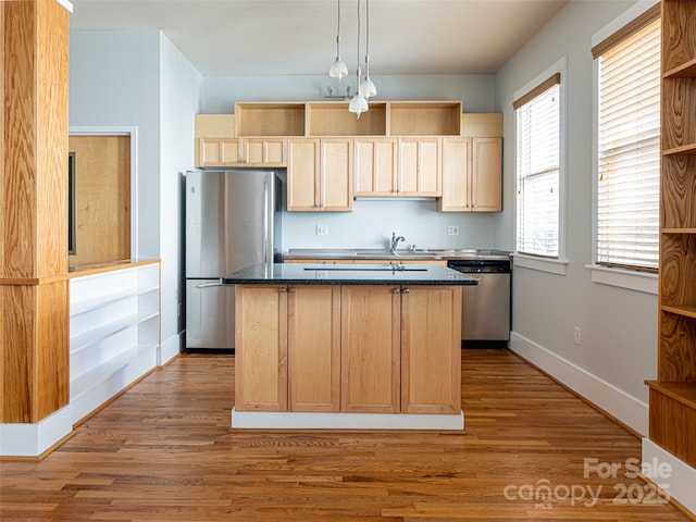 32 Broadway St Unit 230, Asheville, NC 28801 - kitchen featuring light brown cabinetry, open shelves, a sink, a kitchen island, and appliances with stainless steel finishes
