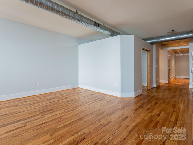 32 Broadway St Unit 230, Asheville, NC 28801 - empty room featuring baseboards and light wood-type flooring