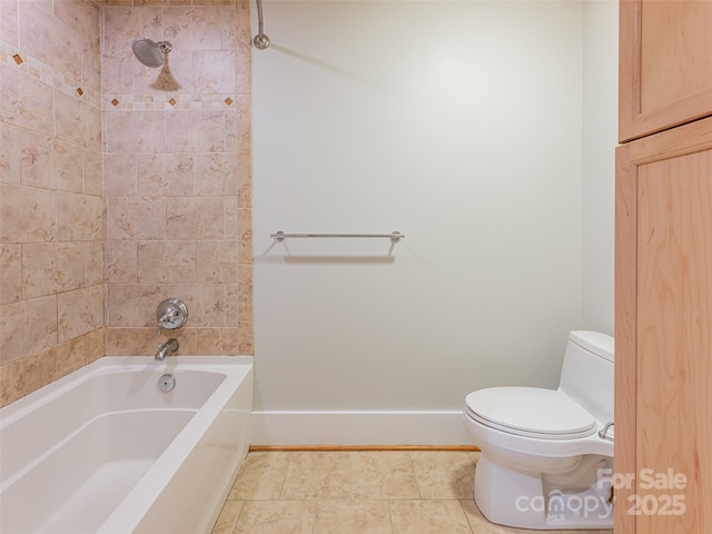 32 Broadway St Unit 230, Asheville, NC 28801 - full bathroom with baseboards, toilet, shower / washtub combination, and tile patterned flooring