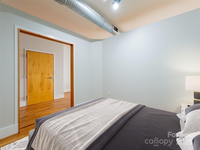 32 Broadway St Unit 230, Asheville, NC 28801 - bedroom with baseboards and wood finished floors