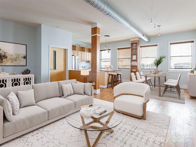 32 Broadway St Unit 230, Asheville, NC 28801 - living room featuring light wood-type flooring and baseboards