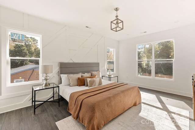 bedroom featuring dark hardwood / wood-style flooring