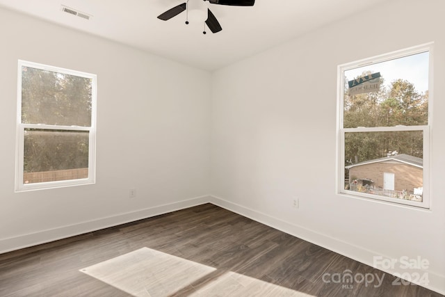 spare room with ceiling fan and wood-type flooring