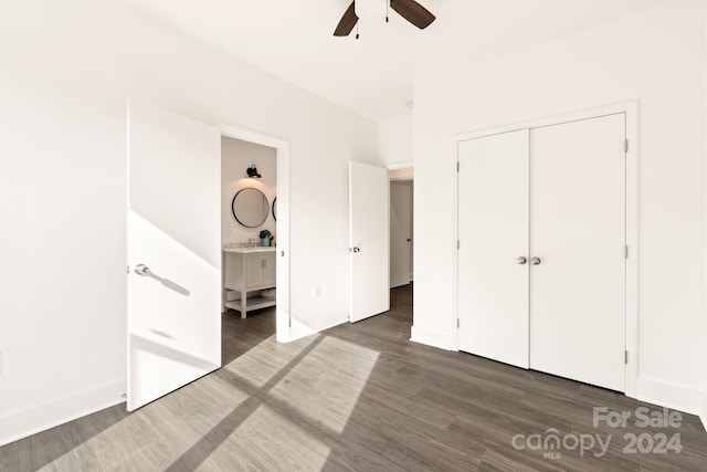 9000 Boyd Dr, Matthews, NC 28105 - unfurnished bedroom with wood finished floors, a closet, connected bathroom, baseboards, and ceiling fan