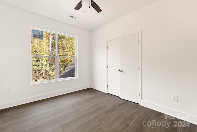 9000 Boyd Dr, Matthews, NC 28105 - unfurnished bedroom with dark wood-type flooring, baseboards, and a ceiling fan