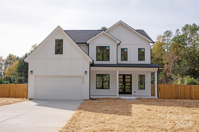 9000 Boyd Dr, Matthews, NC 28105 - modern farmhouse featuring driveway, a garage, a porch, roof with shingles, and board and batten siding