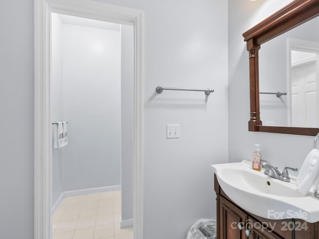 bathroom with tile patterned flooring and vanity