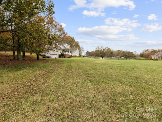 view of yard with a rural view