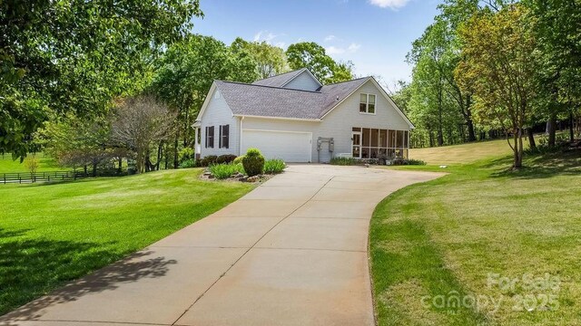 170 Stoneybrook Way, Tryon, NC 28782 - view of front facade with concrete driveway, a garage, roof with shingles, and a sunroom