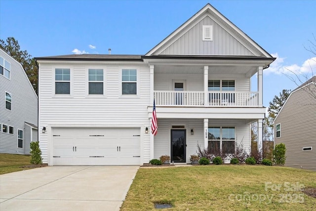 122 W Heart Pine Ln, Statesville, NC 28677 - view of front of house with a balcony, board and batten siding, a front yard, an attached garage, and driveway