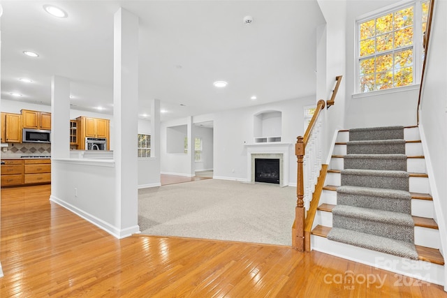 unfurnished living room with light wood-type flooring