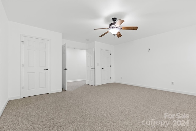 unfurnished bedroom with carpet flooring and ceiling fan