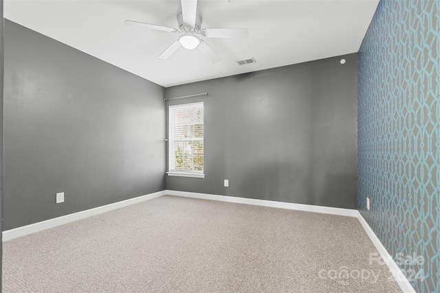 carpeted empty room with ceiling fan