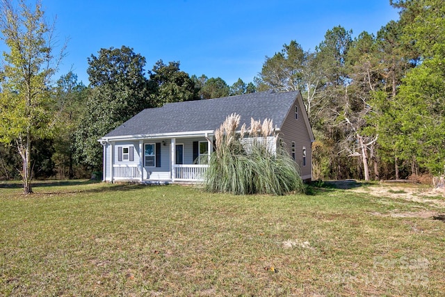 view of front of house featuring covered porch and a front yard