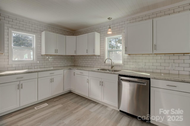 kitchen with visible vents, dishwasher, light wood-type flooring, white cabinetry, and a sink