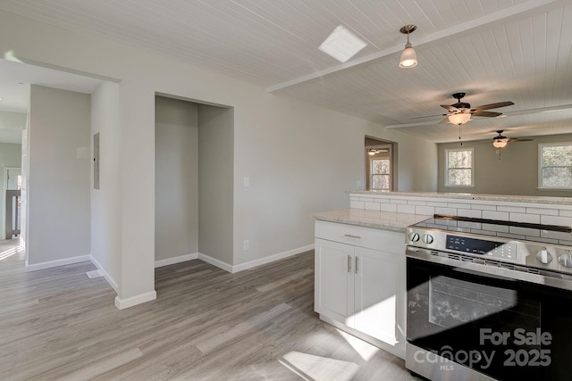 kitchen with ceiling fan, baseboards, stainless steel electric range oven, light wood-type flooring, and white cabinetry