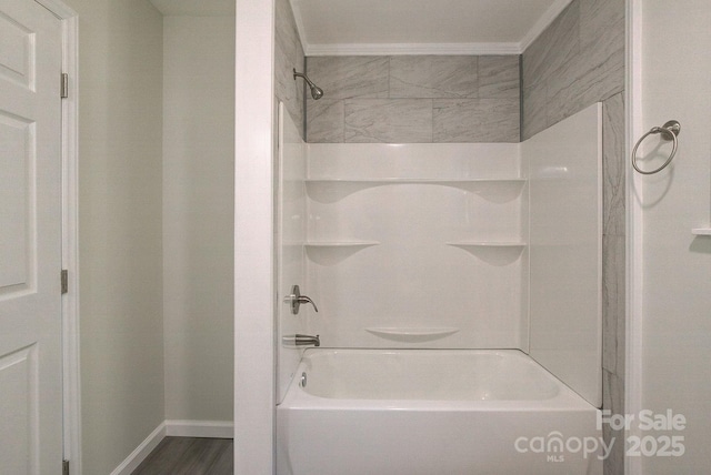 full bath with baseboards, shower / tub combination, and ornamental molding