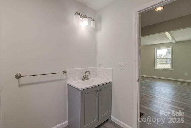 bathroom featuring baseboards and wood finished floors