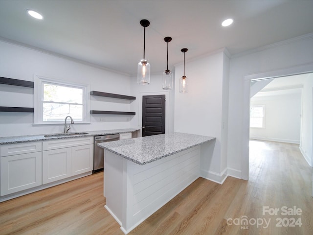 kitchen featuring light stone counters, sink, light hardwood / wood-style floors, white cabinets, and dishwasher