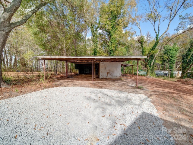 exterior space with a carport