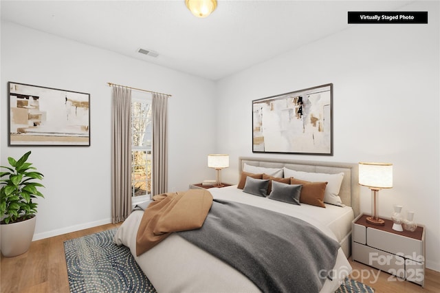 bedroom featuring wood-type flooring