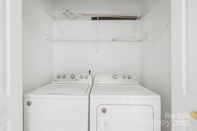 laundry room with washing machine and dryer