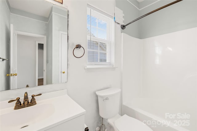 full bathroom featuring vanity, shower / washtub combination, and toilet